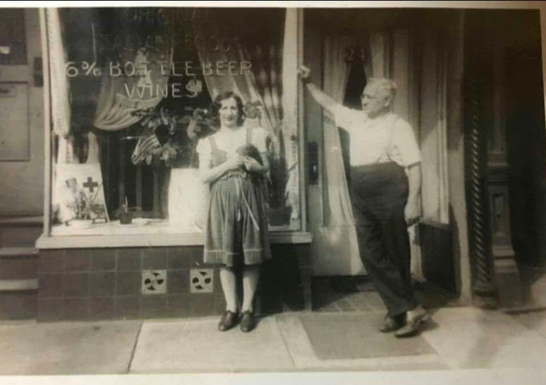 a group of people standing in front of a building